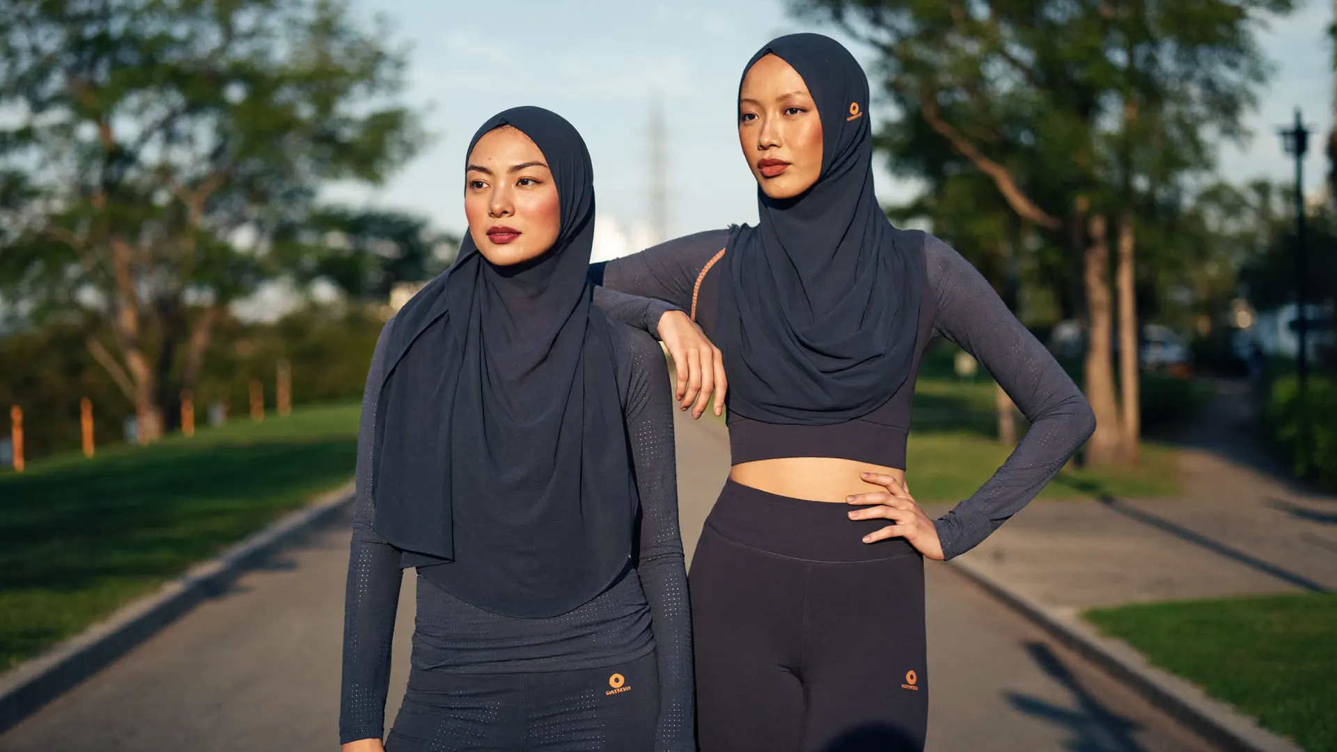 Malaysian women in modest navy Malay activewear outdoors